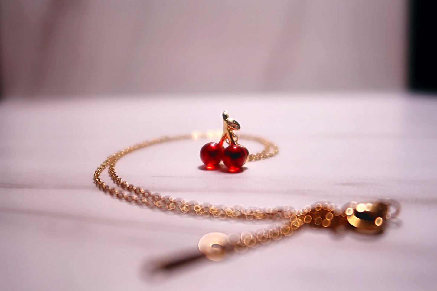 CHARMED CHERRY NECKLACE