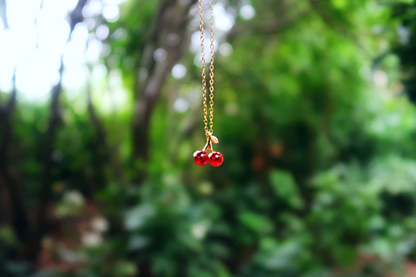 CHARMED CHERRY NECKLACE