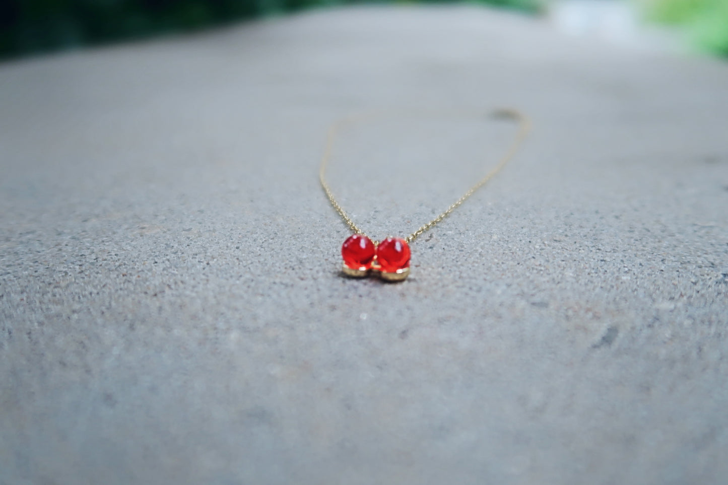 CHARMED CHERRY NECKLACE